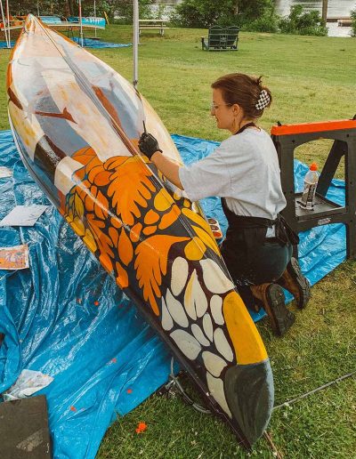 Taylor painting canoe