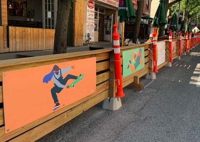 Artwork displayed on the side of a patio in Toronto, ON