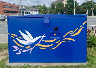Deep Blue painted power box with white painted bird on it carrying a pink branch.